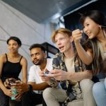 Four friends gaming enthusiastically inside a modern home, enjoying a lively moment. — An Introduction to the Benefits of a R