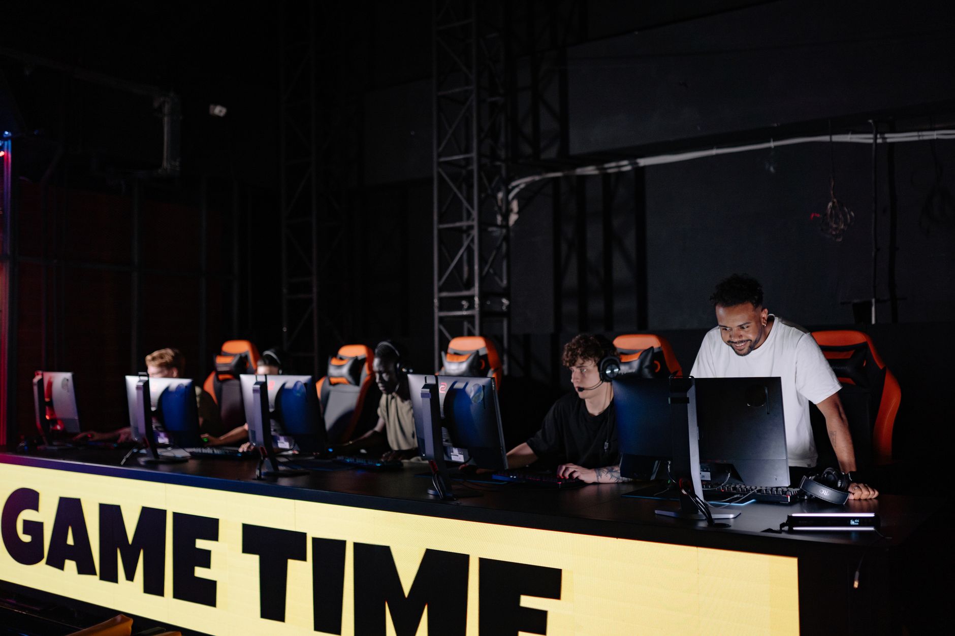Esports team engaged in competitive gaming session indoors, showcasing teamwork and concentration. — How to Enjoy Betting on