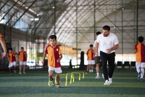 Energetic indoor soccer training with kids and coach, focusing on agility and teamwork. — How To Market The Business Or Brand