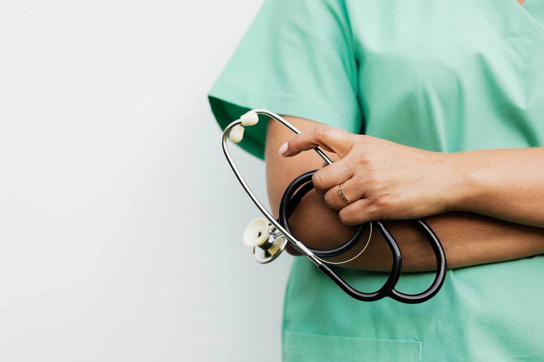 Close-up of a healthcare worker holding a stethoscope, showcasing medical professionalism. — Personalized Pain Treatment Plan