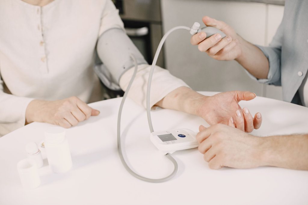 Close-up of blood pressure measurement at home highlighting healthcare equipment. — Stuart Piltch: Innovator at the Intersect