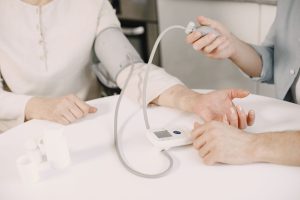 Close-up of blood pressure measurement at home highlighting healthcare equipment. — Stuart Piltch: Innovator at the Intersect