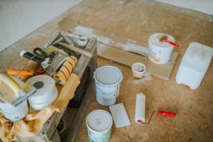 Overhead shot of tools and paint supplies for a home renovation project. — Tips Prior To Taking Poor Credit Do It Yourself Lo