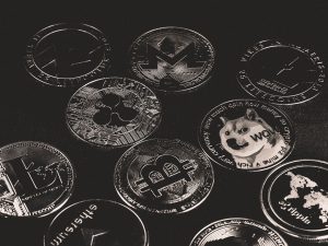 A collection of various cryptocurrency coins including Bitcoin, Ethereum, and Dogecoin. — Top Crypto Research Tools Every Inv