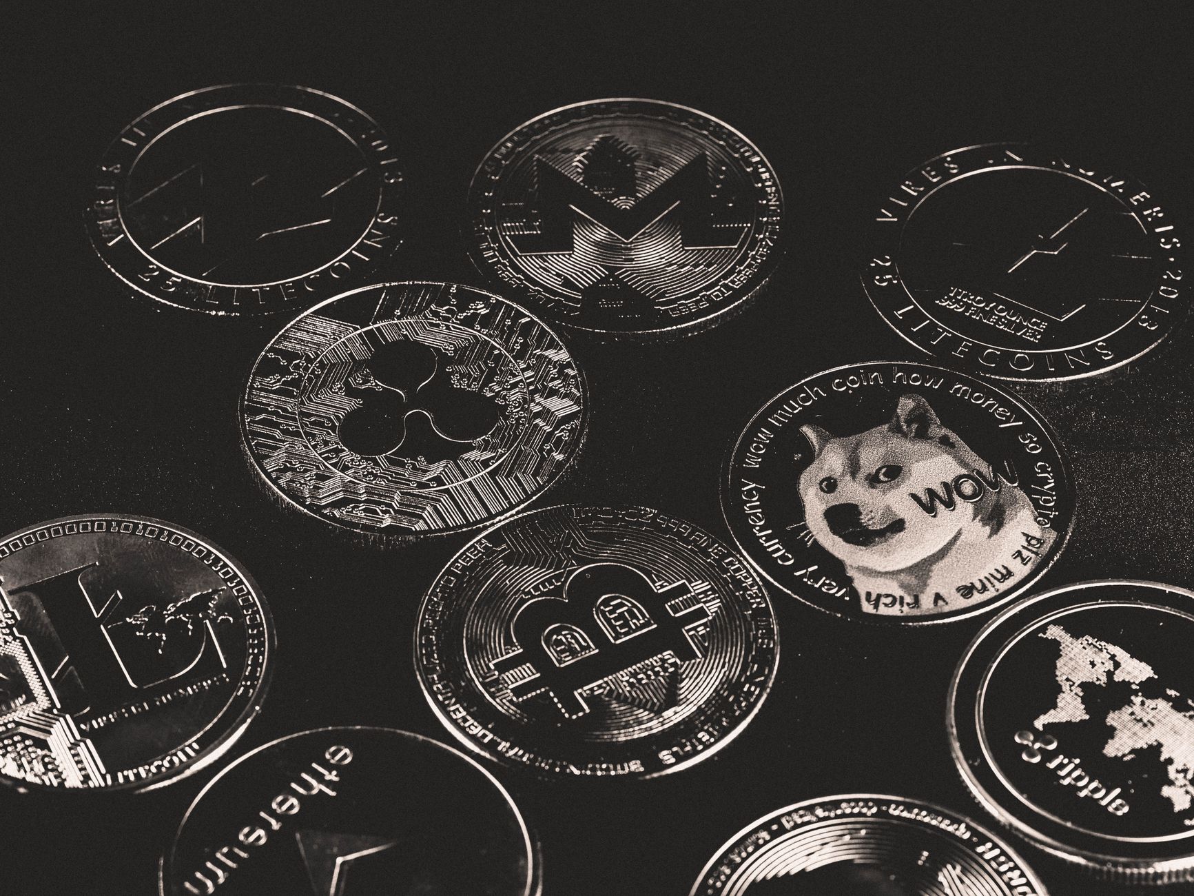 A collection of various cryptocurrency coins including Bitcoin, Ethereum, and Dogecoin. — Top Crypto Research Tools Every Inv