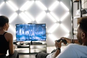 Two adults are having fun playing video games in a stylish, modern living room with LED lighting. — What are the top 5 tips f
