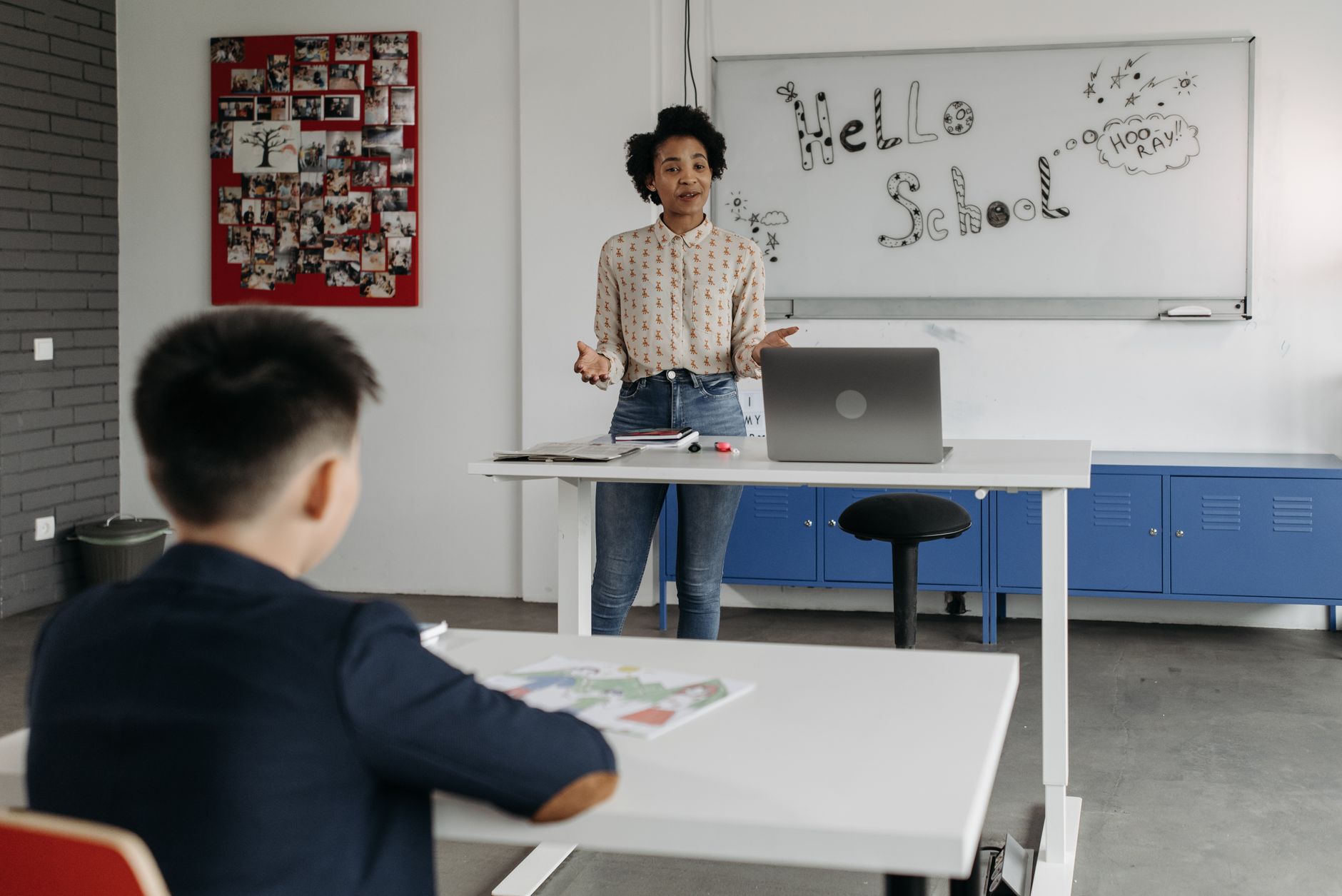 Educator leads interactive lesson in a classroom with a whiteboard display. — Why Learning Spanish Online Makes Language Lear